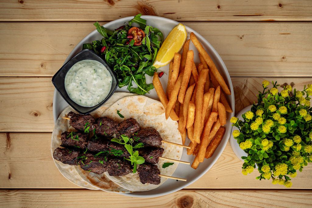 Elephantas open souvlaki — lamb backstrap, tzatziki, chips.